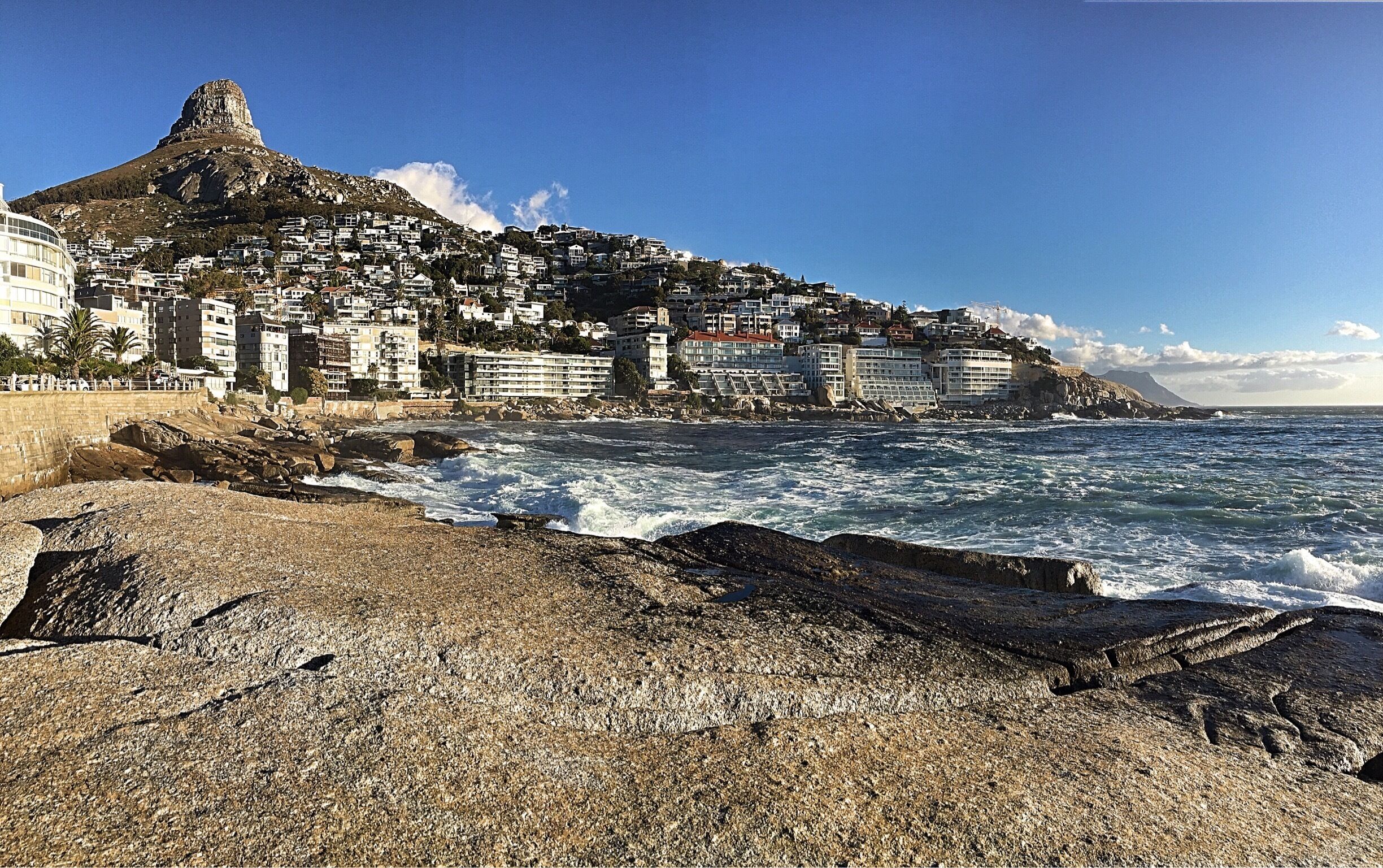 This is taken from the tidal pools in Sea Point, an excellent place to play, people watch, and even boulder a bit too. This breathtaking view includes the beachy architecture of the nearby buildings and features Lion's Head in the background. Tip: some people bring a slack line to traverse between the tidal pools, so make sure to practice your balance beforehand! #aquatrove #beach #southafrica #coastal #beachtips #nature