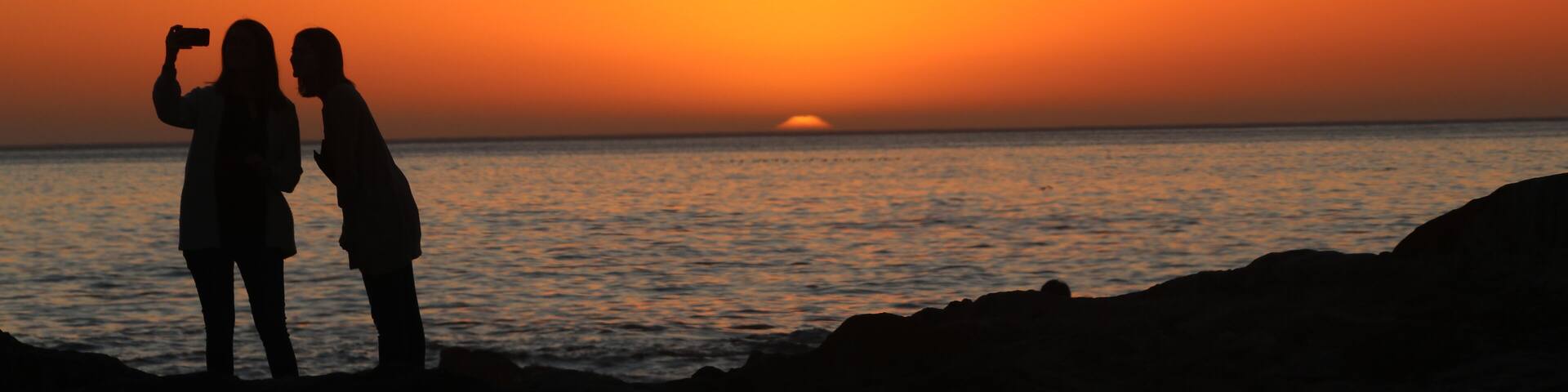 The rocky boulder strewn shore makes a marvelous spot to sit at night and watch the sun set in the Atlantic. #Trovember sunsets are awesome.