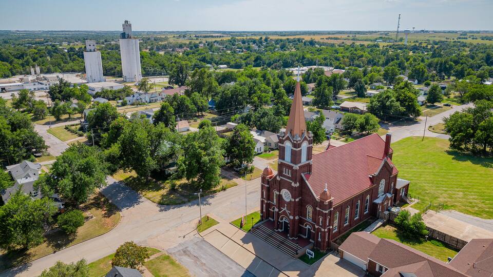 Aerial view of the Saint Rose of Lima Catholic Church and Perry town cityscape