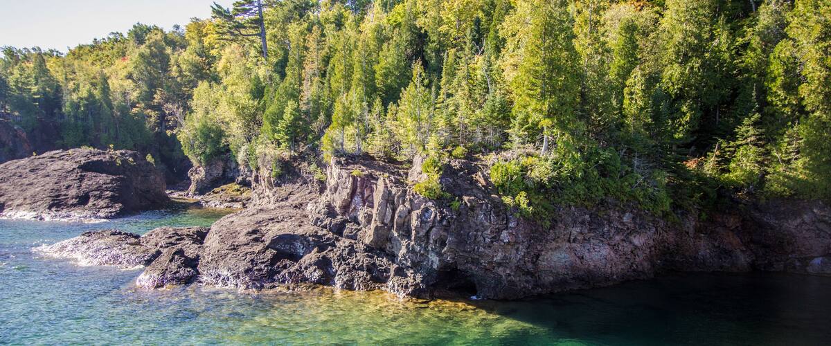 Lake Superior Cliffs. Cliffs in the Marquette Presque Isle city park is a popular cliff diving location in the Upper Peninsula of Michigan.