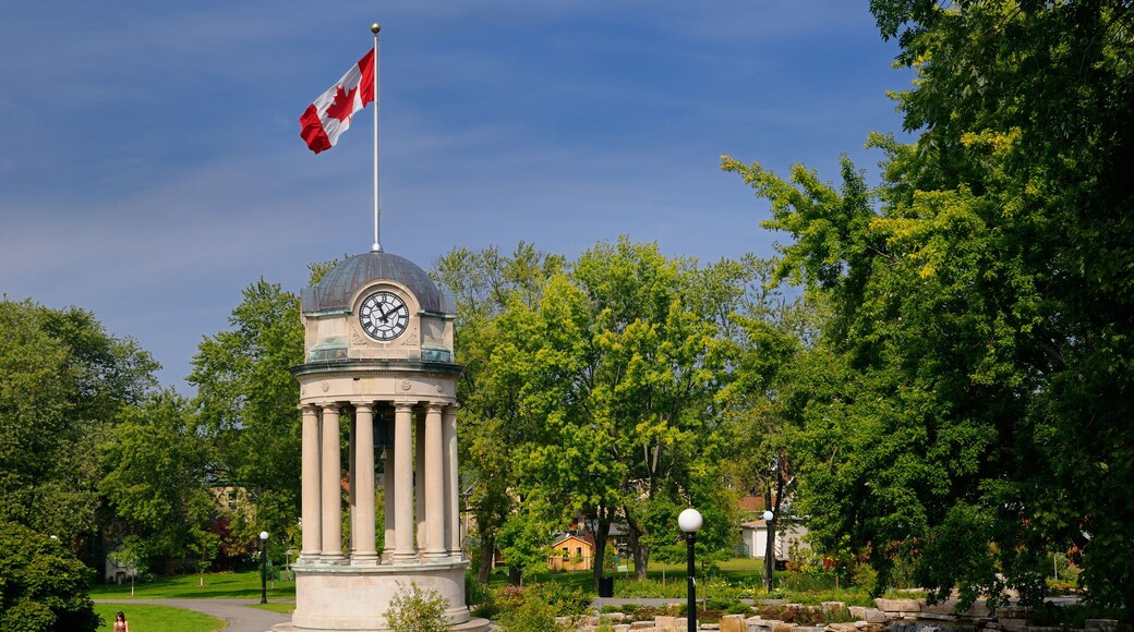 Old City Hall Clock Tower and fountain in Victoria Park Kitchener with Canadian flag
