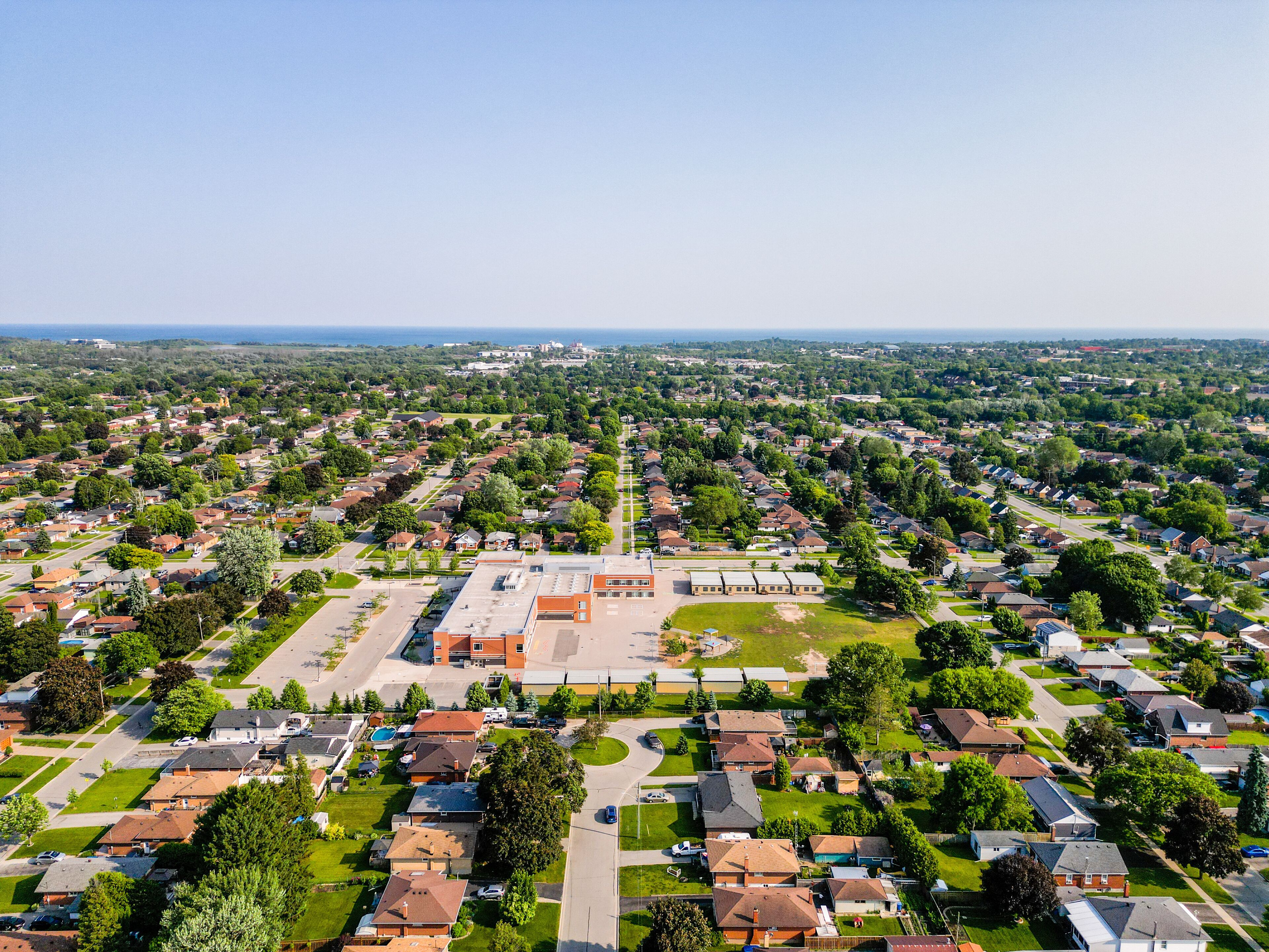 Explore Oshawa, Ontario with stunning drone photography. Capture striking aerial views of Lake Ontario, Lakeview Park, and Highway 400. Highlight Durham's real estate market, featuring exquisite homes