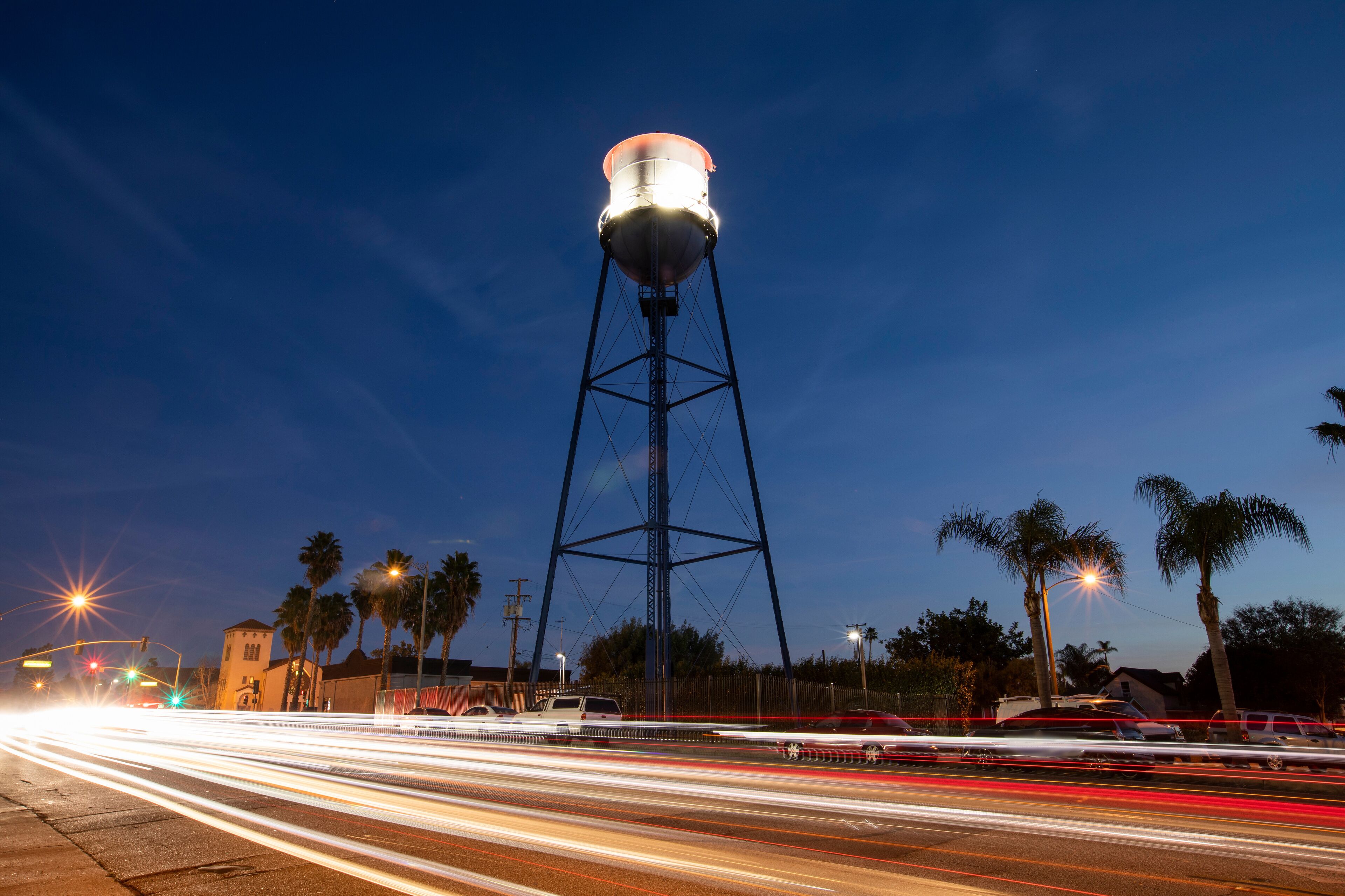 Sunset twilight view of the historic 1935 water tower of downtown Placentia, California, USA.