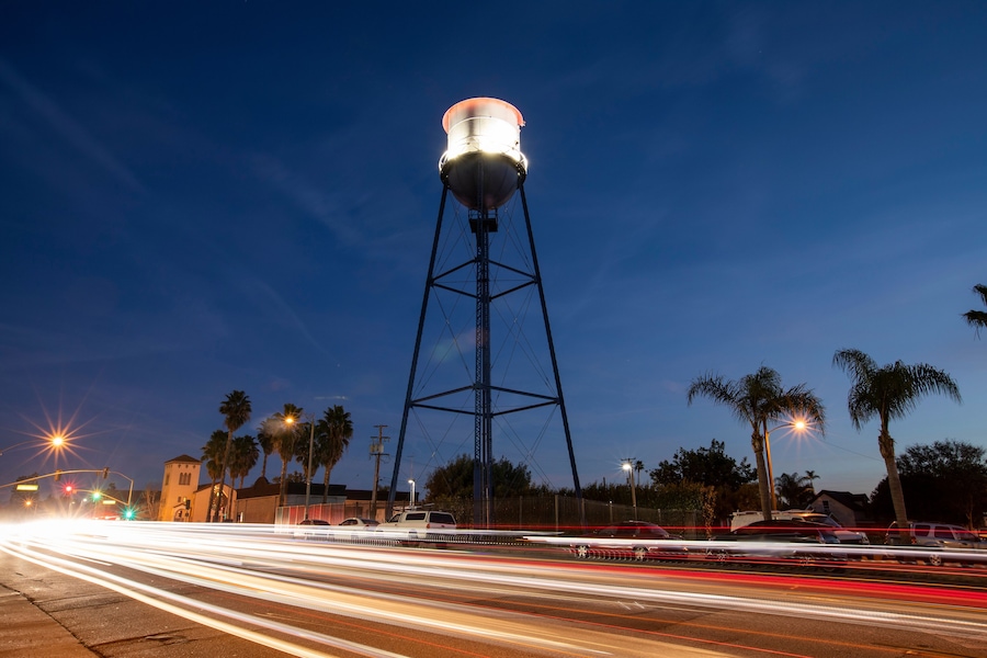 Sunset twilight view of the historic 1935 water tower of downtown Placentia, California, USA.