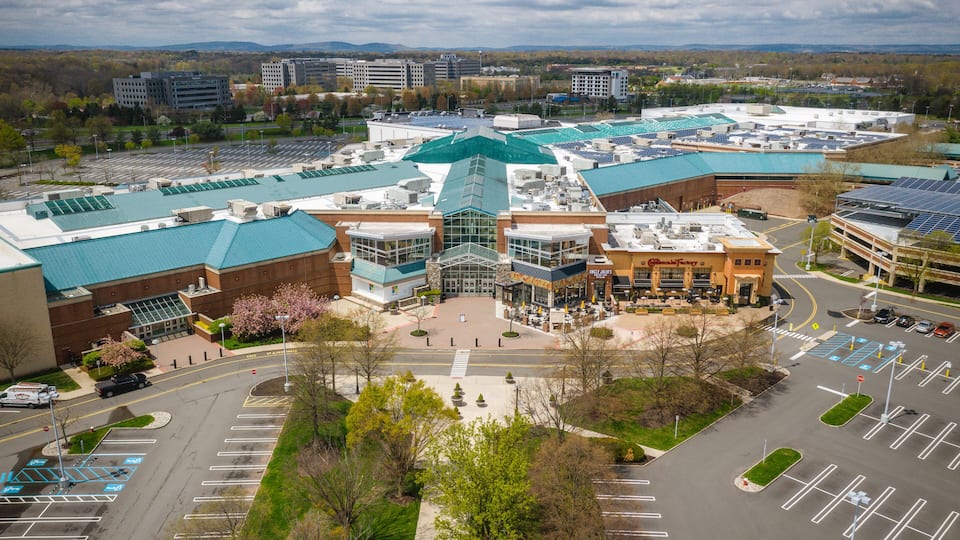 A large campus with multiple buildings, parking lots, and green spaces.