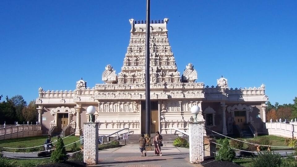 A temple with intricate carvings and a central spire.