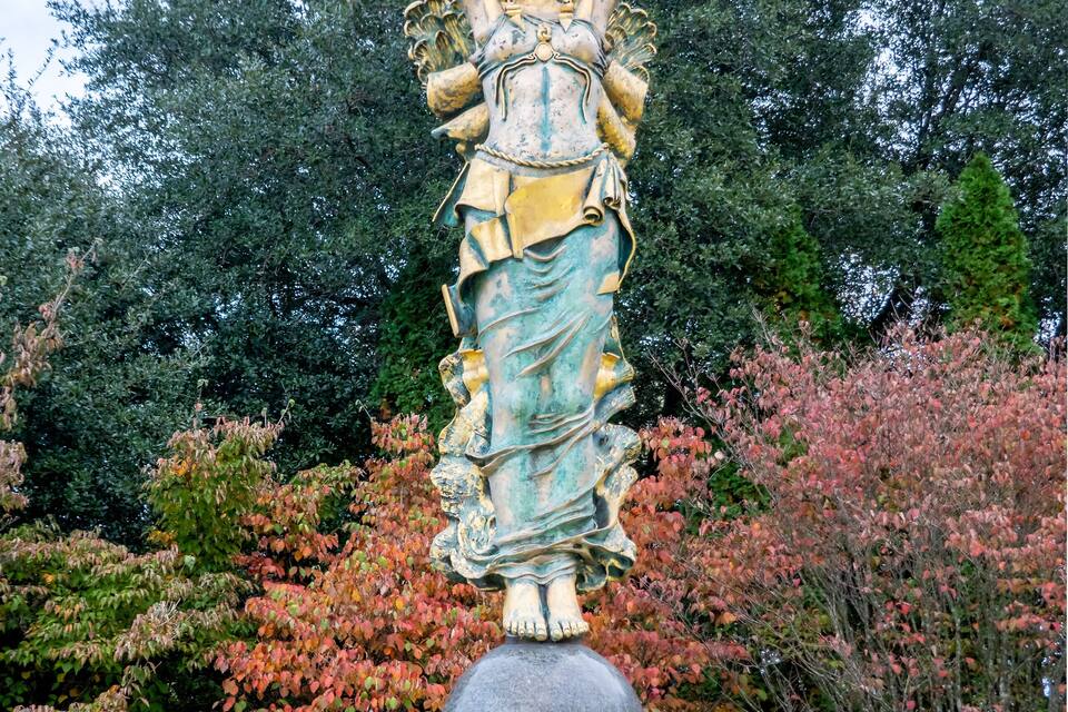 A statue of a woman holding a shield and a spear, standing on a pedestal labeled "CIVITAS."
