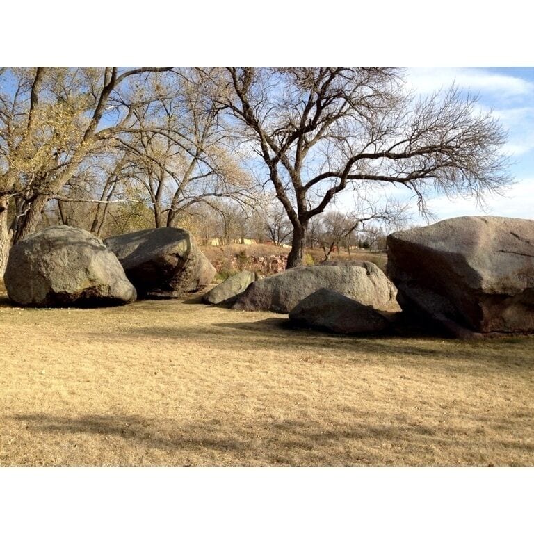 The Three Maiden Boulders, said to be the guardians of the sacred red stone cliffs of Pipestone, a religious Location for the Sioux tribes.