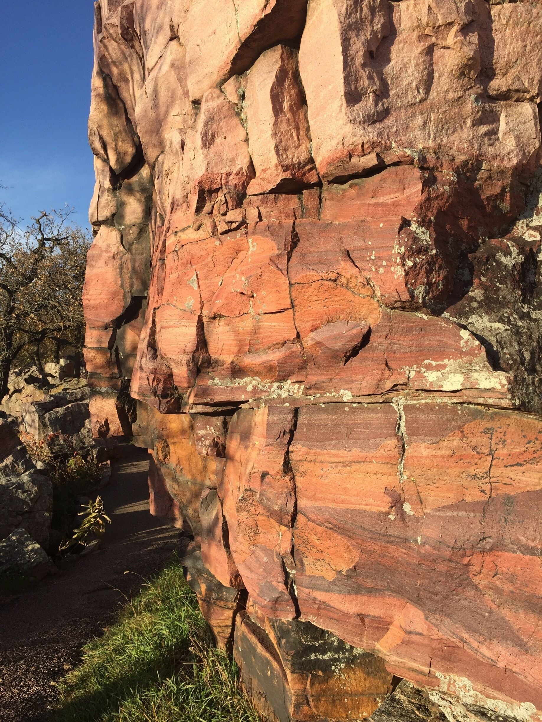 The easy 3/4 mile circle loop trail at Pipestone National Monument winds along the face of the Sioux Quartzite cliffs.  The Monument is an incredible place. The historical and spiritual significance of the site is palpable. A place of deep reverence and peace. Visit when the sun is low in the west, lighting up the quartzite cliffs as they rise from the vast golden prairie surrounding them. 