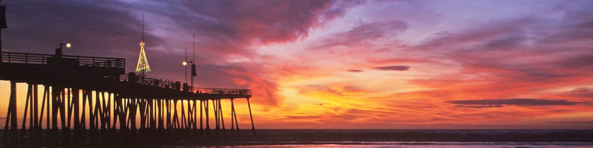 Pismo Beach qui includes coucher de soleil, scĂšnes tropicales et vues
