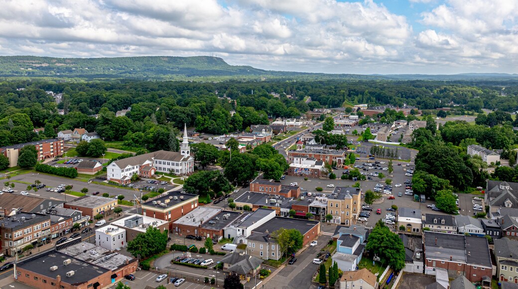 Southington, CT Downtown Aerial Image. High Quality view of downtown Southington overlooking the center and green by Town Hall and the Congregational Church. Many local shops and businesses shown.