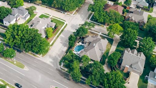 Panorama aerial view two story houses along West Plano Parkway with solar panel roof, modern inground pools, upscale neighborhood green space in rapid growing Plano, Texas, suburbs DFW metroplex