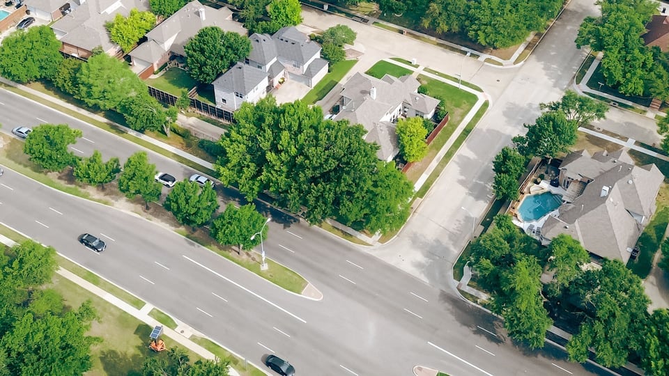 Panorama aerial view two story houses along West Plano Parkway with solar panel roof, modern inground pools, upscale neighborhood green space in rapid growing Plano, Texas, suburbs DFW metroplex