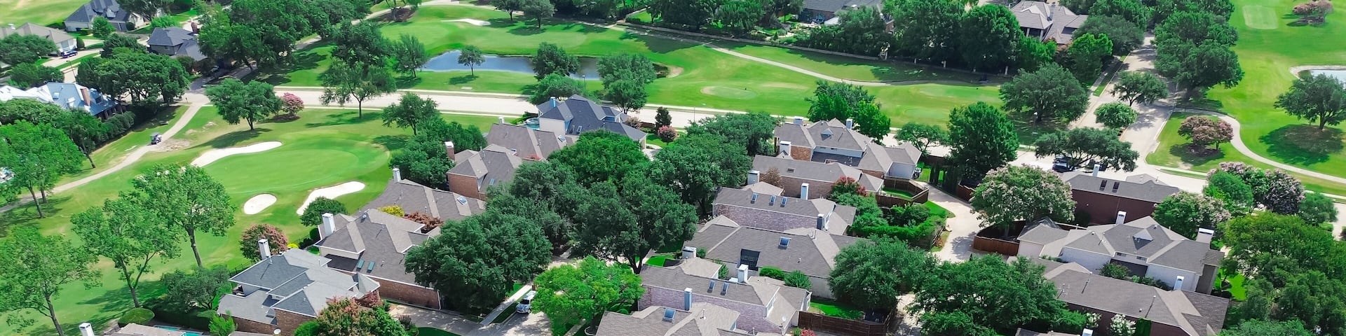 Cul-de-sac dead end street in luxury golf course neighborhood row of mansion houses swimming pool, large fenced backyard, East of Plano, Texas, Dallas Fort Worth area, lush greenery, aerial view