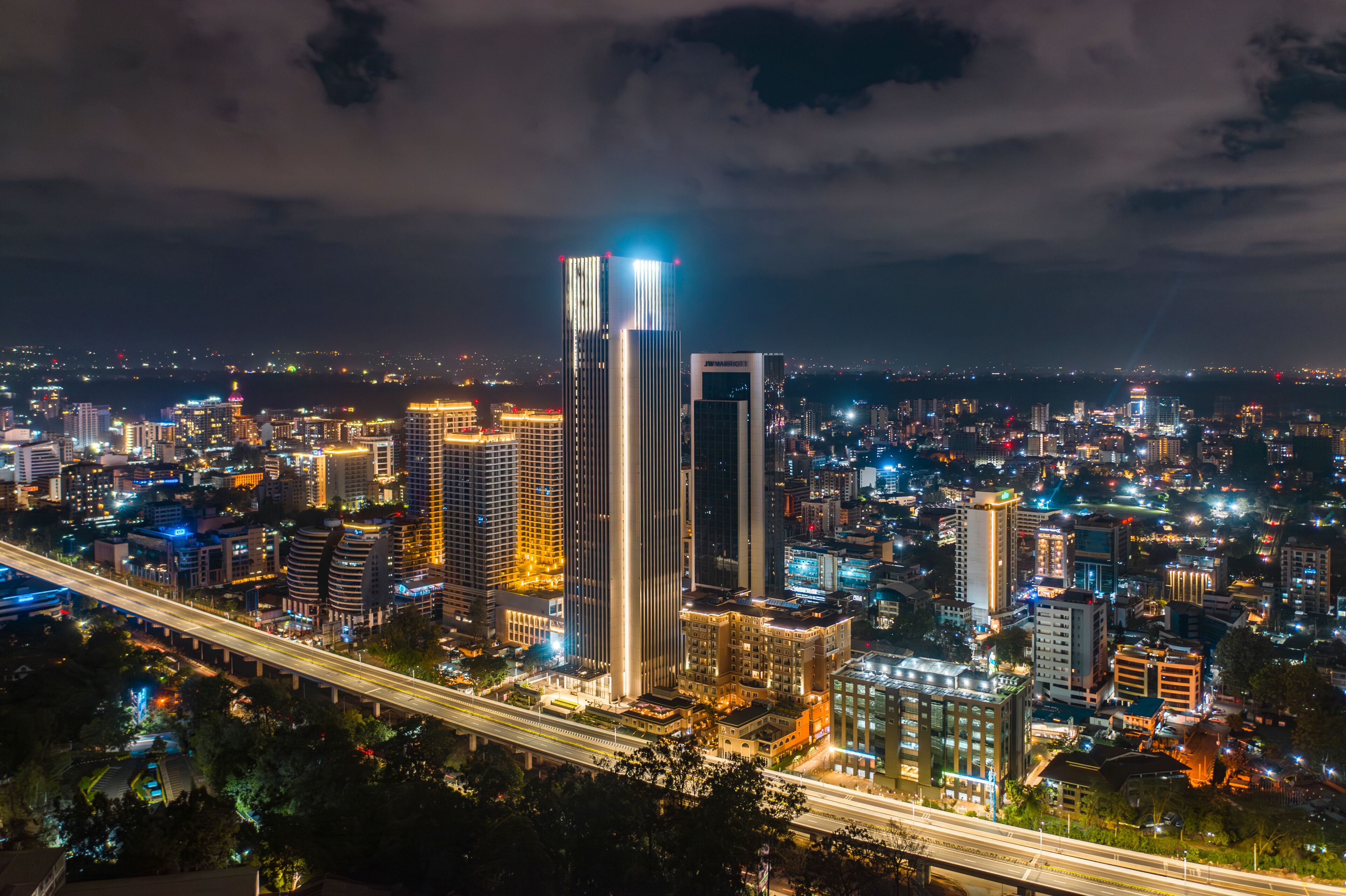 Aerial view of vibrant cityscape with illuminated buildings and bustling traffic, Westlands, Nairobi, Kenya.