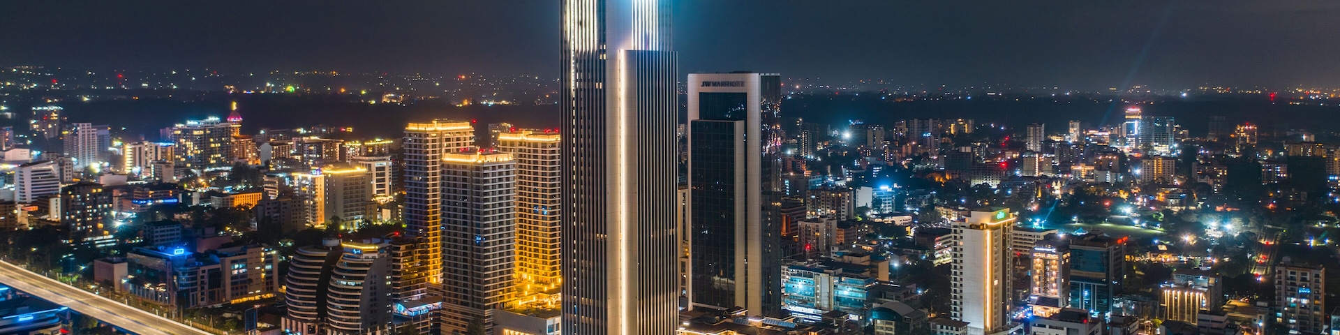 Aerial view of vibrant cityscape with illuminated buildings and bustling traffic, Westlands, Nairobi, Kenya.