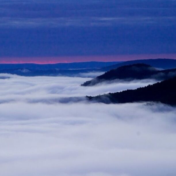 Sunrise over foggy mountains at the Eastern Summit. 