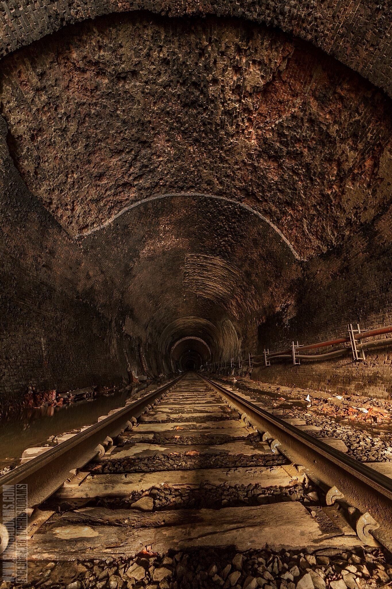 The site of nearly 200 horrible deaths, the 4.75 mile long Hoosac Tunnel is just as well known as "The Bloody Pit".