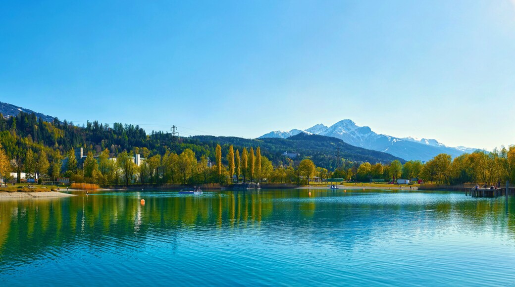 Beautiful Mountains and a lake in autumn. Baggersee (Badesee Rossau), Innsbruck, Austria
