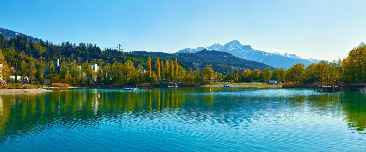 Beautiful Mountains and a lake in autumn. Baggersee (Badesee Rossau), Innsbruck, Austria