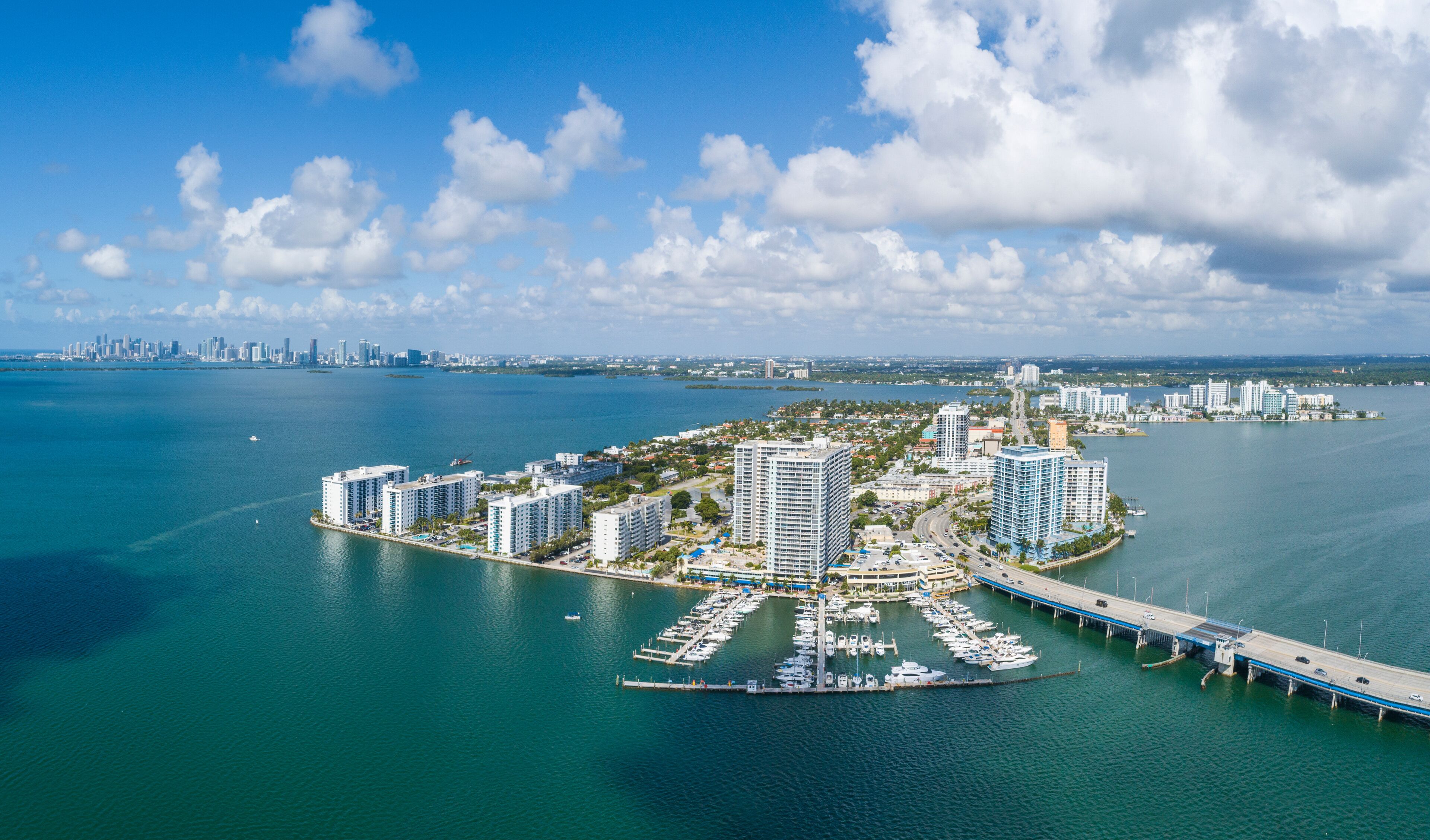 Aerial view of sandy beach and skyscrapers along the coast, North Bay Village, Biscayne Bay, Miami Beach, Florida, United States.