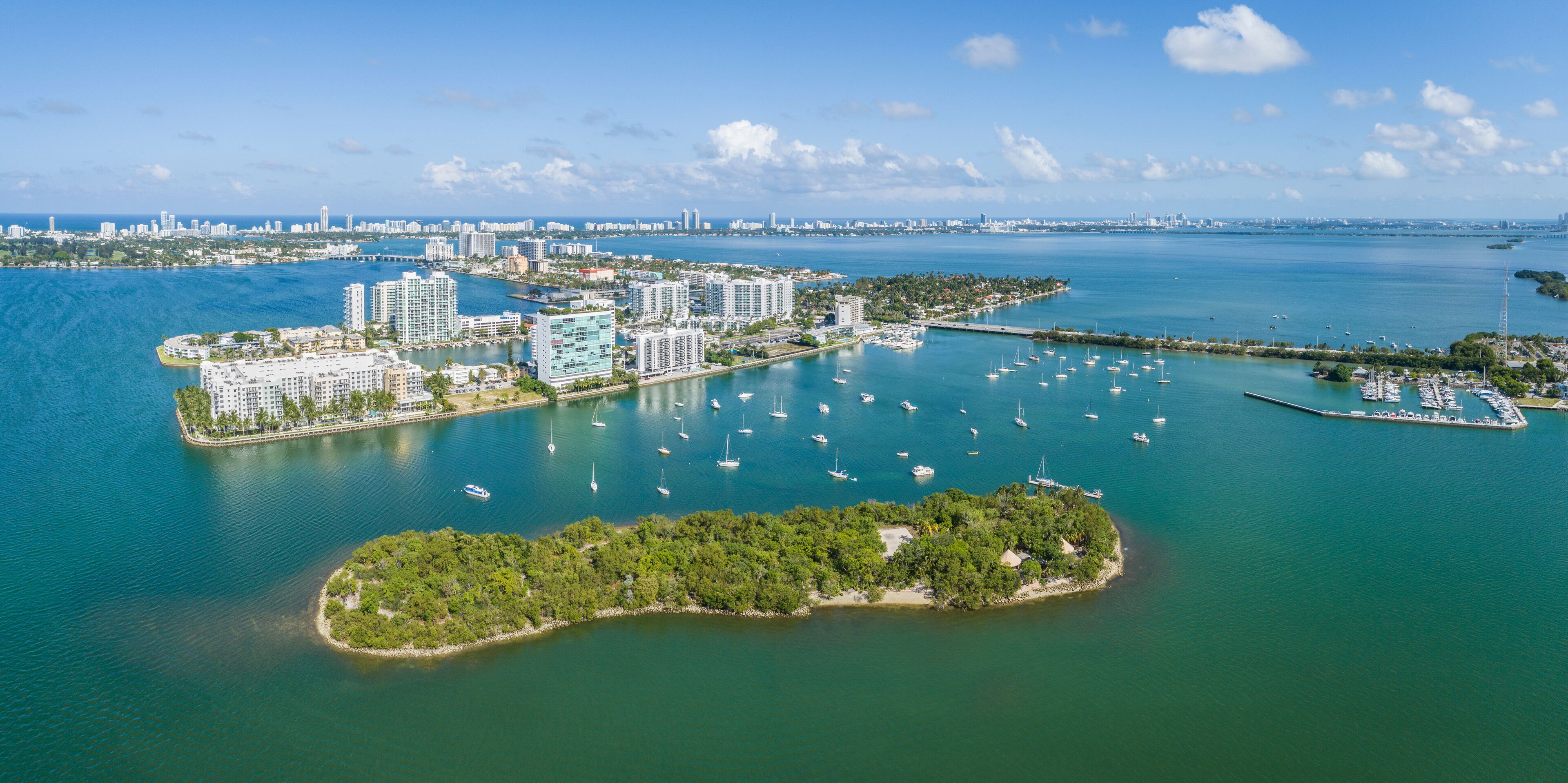 Aerial view of beautiful sandy shore and skyscrapers along Biscayne Bay, North Bay Village, Florida, United States.