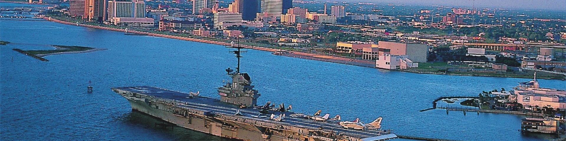 View of Corpus Christi waterfront and aircraft carrier in Texas during late afternoon