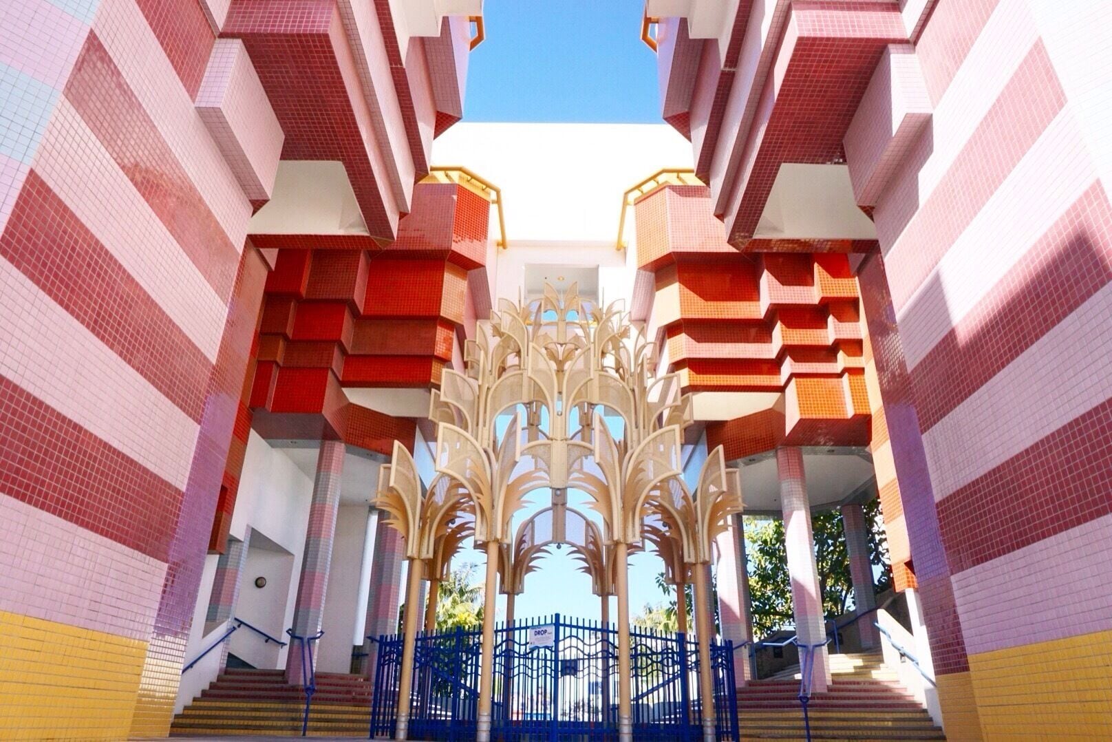 The building looks beautiful and you feel like you're in the Mediterranean, surrounded by white buildings with blue accents until you arrive at the foyer of City All and your senses are engulfed by two stories of colored tile and a beautiful golden fountain. 