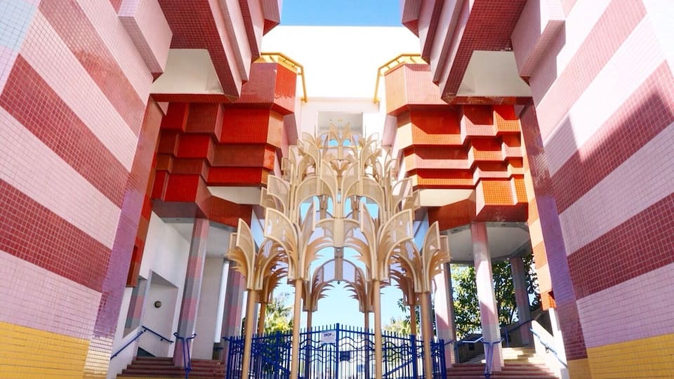 The building looks beautiful and you feel like you're in the Mediterranean, surrounded by white buildings with blue accents until you arrive at the foyer of City All and your senses are engulfed by two stories of colored tile and a beautiful golden fountain.