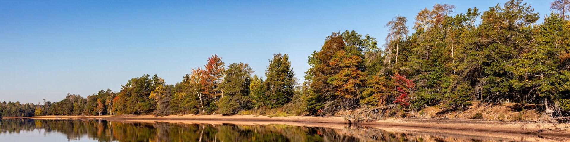 Colorful trees on Lake Nokomis, Tomahawk Wisconsin at the end of Septmber
