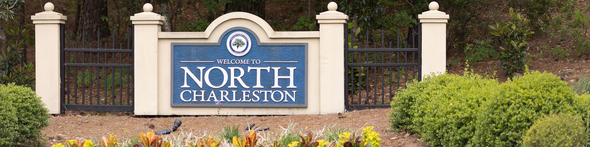 North Charleston, South Carolina city limits welcome sign with trees and flowers off of interstate I-26 in South Carolina