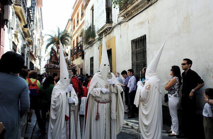 Cordoba is one of the best places to see the traditional Semana Santa in Spain, or Holy Week around Easter. Sevilla has the more well known Semana Santa but's its super touristy and crowded whereas in Cordoba still feels very local.

http://youngadventuress.com/2012/03/mysterious-walls-of-cordoba.html