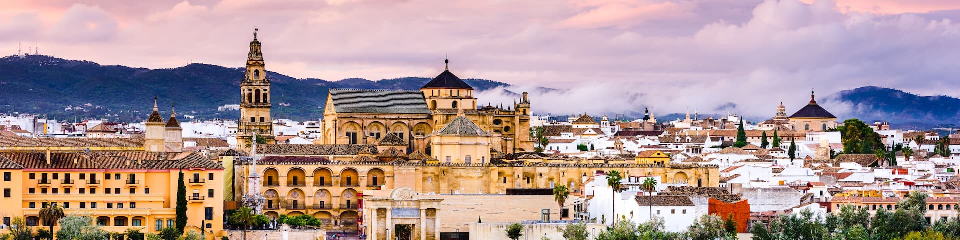 Cordoba, Spain at the Roman Bridge and Mosque-Cathedral on the Guadalquivir River.
