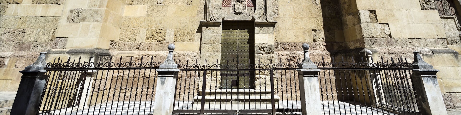 Wide view of the San Miguel gate on the west facade of the Mosque-Cathedral of Cordoba, Spain; Shutterstock ID 413205478; purchase_order: Comps; job: ; client: ; other: