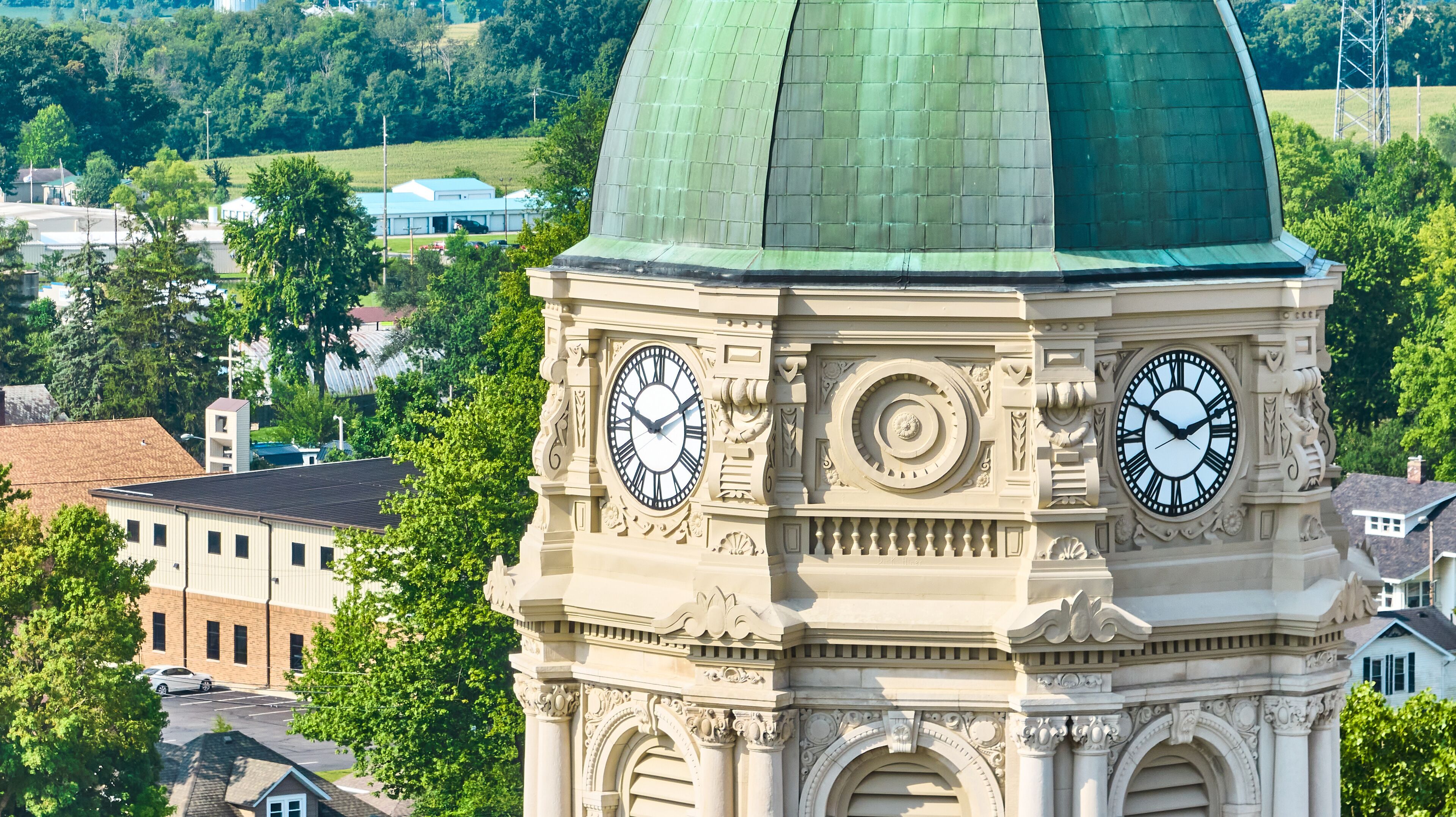 Close up aerial of Columbia City courthouse clock tower with dome
