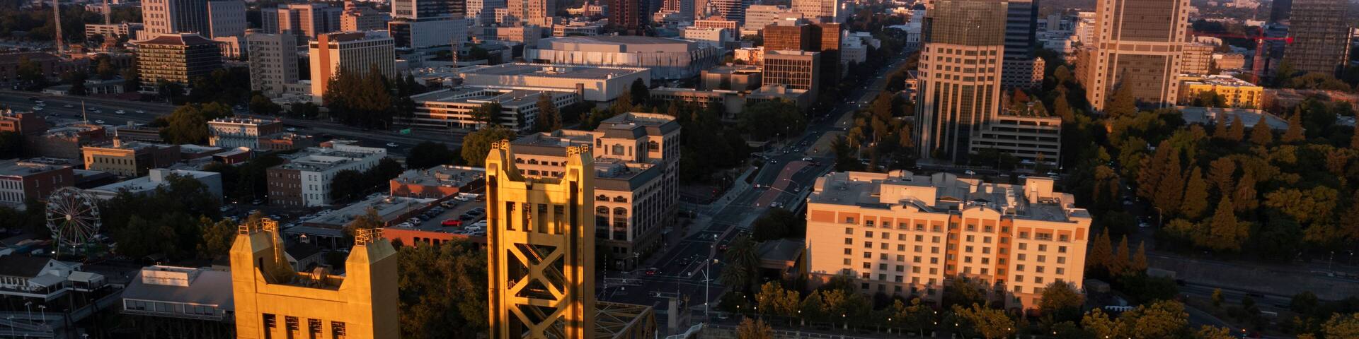 Sunset view of the historic 1935 Tower Bridge and the downtown skyline of Old Sacramento, California, USA.