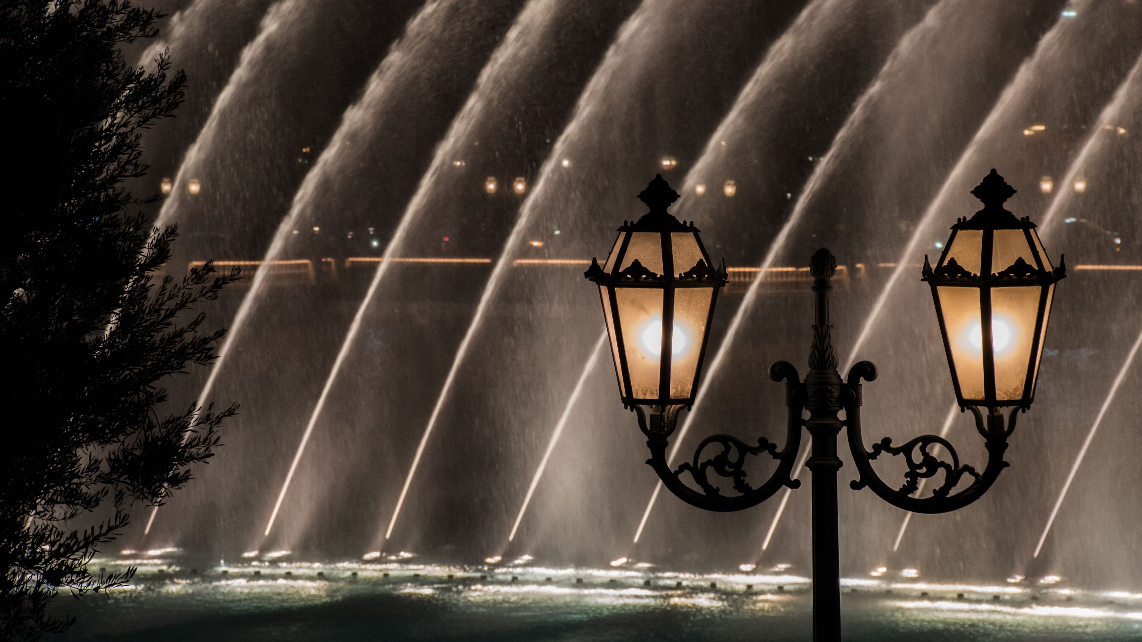 Old vintage lantern by the Bellagio Fountain lights at night tourist attraction