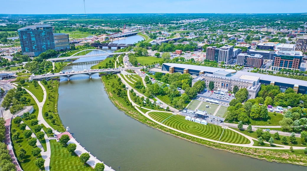 Aerial Scioto Mile Greenway and promenade with winding river leading out of Columbus city