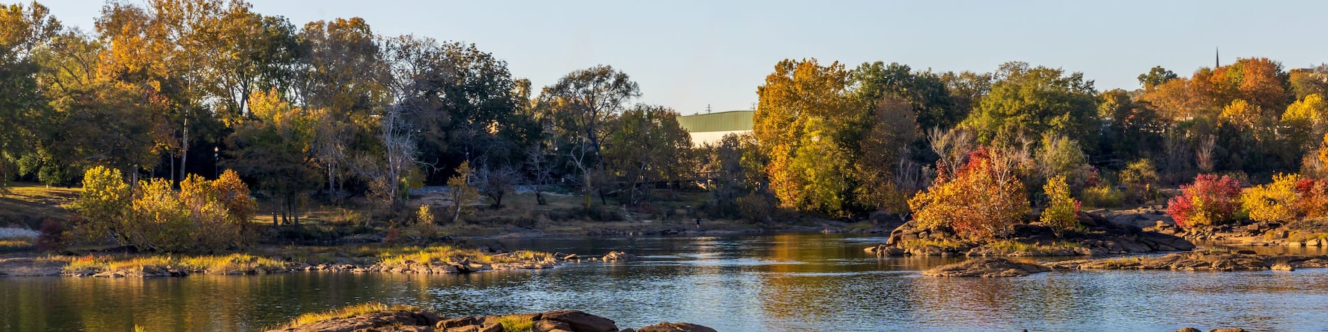 Scenic Woodruff Riverfront Park and Historic Riverfront Industrial District in Columbus, Georgia, at sunset