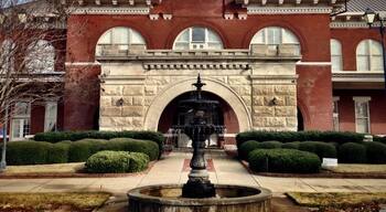 The Central of Georgia Railroad's Station, designed by Bruce and Morgan of Atlanta, GA, was erected in 1901. Featuring massive granite arches, it served as the transportation hub of the city for over 70 years. Threatened with demolition in 1984, this landmark, on the eastern perimeter of the Original City, was saved through the leadership of the Historic Columbus Foundation and the generosity of the Southern Railway System and the Consolidated Government of Columbus and its citizens. The property was listed on the National Register of Historic Places in 1980.