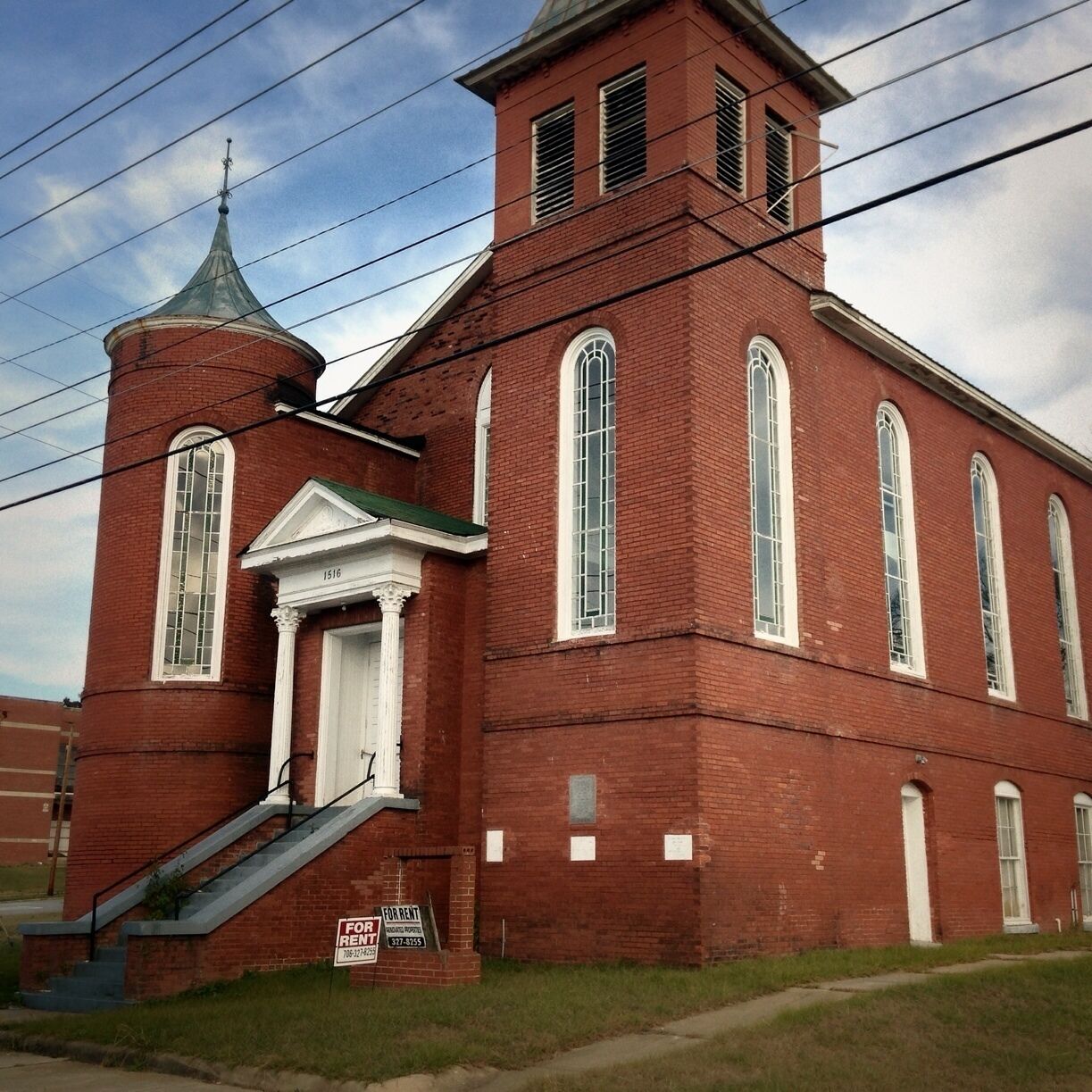 This one-story Victorian Gothic structure dates back to 1870. The cornerstone of the church indicates that the building was constructed in 1870 with the basement added in 1890. This suggests that the original wooden church was raised, a basement added, and then the entire structure bricked in. St. John AME Church was originally named St. John Chapel and its congregation descended from that of St. James AME church in Columbus. The congregation was forced to move to a new site when the historic structure was severely damaged by a tornado. The Faith Tabernacle Full Gospel Outreach Church bought the St. John AME Church in 1993, committed to its restoration.