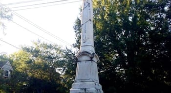 A shaft of white marble erected in 1879 by the Ladies Memorial Association is dedicated to the Columbus soldiers who fought in the War Between the States. It differs from most monuments of the period in that it is topped with a simple Grecian urn rather that the usual statuary. Originally it had a fence with a turnstile around it to keep the cattle out. The park area surrounding it, known as Salisbury Park, was named for Major William Salisbury whose home formerly faced the park.
The monument holds special significance because the last major land battle of the War Between the States took place in Columbus. Union soldiers led by General James Wilson managed crossing the Chattahoochee River by bridge into Columbus. General Wilson was only 28 years old and was often referred to as “the boy wonder.” After arriving in Columbus, Union troops were ordered to burn any industry that could contribute to the war effort. In actuality, Lee had surrendered to Grant two weeks prior, but the news had not yet reached this far south.