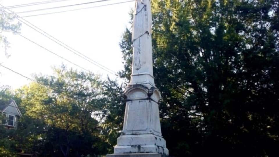 A shaft of white marble erected in 1879 by the Ladies Memorial Association is dedicated to the Columbus soldiers who fought in the War Between the States. It differs from most monuments of the period in that it is topped with a simple Grecian urn rather that the usual statuary. Originally it had a fence with a turnstile around it to keep the cattle out. The park area surrounding it, known as Salisbury Park, was named for Major William Salisbury whose home formerly faced the park.
The monument holds special significance because the last major land battle of the War Between the States took place in Columbus. Union soldiers led by General James Wilson managed crossing the Chattahoochee River by bridge into Columbus. General Wilson was only 28 years old and was often referred to as “the boy wonder.” After arriving in Columbus, Union troops were ordered to burn any industry that could contribute to the war effort. In actuality, Lee had surrendered to Grant two weeks prior, but the news had not yet reached this far south.