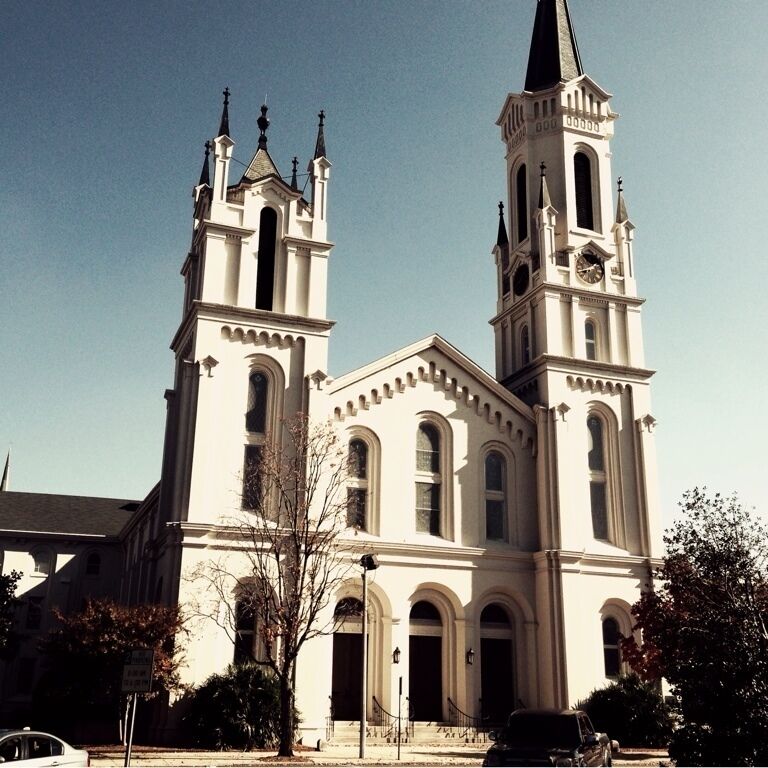 A large church with two towers and a steeple.