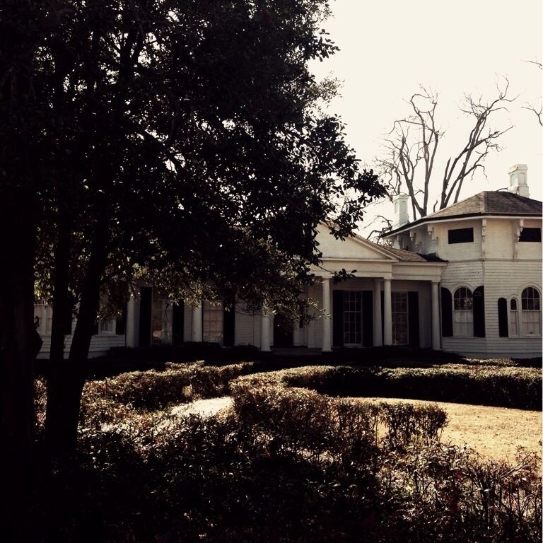 In 1844, Lambert Spencer built a simple Greek Revival home detailed with Doric columns and acanthus leaves. In 1868, Mr. and Mrs. Lloyd Bowers enlarged and beautified the home. Mr. Bowers added tow hexagonal wings and hired an itinerant painter to paint three ceiling frescoes. Mrs. Bowers, with the help of an English gardener, laid out a formal butterfly-shaped garden. The kitchen was a separate building, joined to the house by a covered porch. Other outbuildings included a two-story servant house, smokehouse, well, wash house, barn and cow shed. The house was placed on the National Register of Historic Places in 1972.