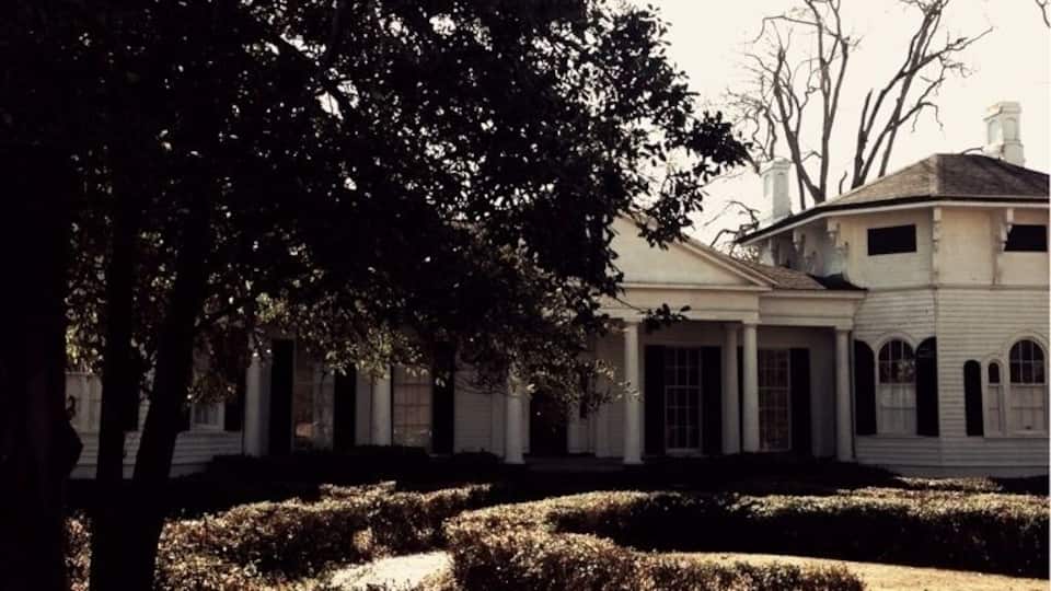 In 1844, Lambert Spencer built a simple Greek Revival home detailed with Doric columns and acanthus leaves. In 1868, Mr. and Mrs. Lloyd Bowers enlarged and beautified the home. Mr. Bowers added tow hexagonal wings and hired an itinerant painter to paint three ceiling frescoes. Mrs. Bowers, with the help of an English gardener, laid out a formal butterfly-shaped garden. The kitchen was a separate building, joined to the house by a covered porch. Other outbuildings included a two-story servant house, smokehouse, well, wash house, barn and cow shed. The house was placed on the National Register of Historic Places in 1972.