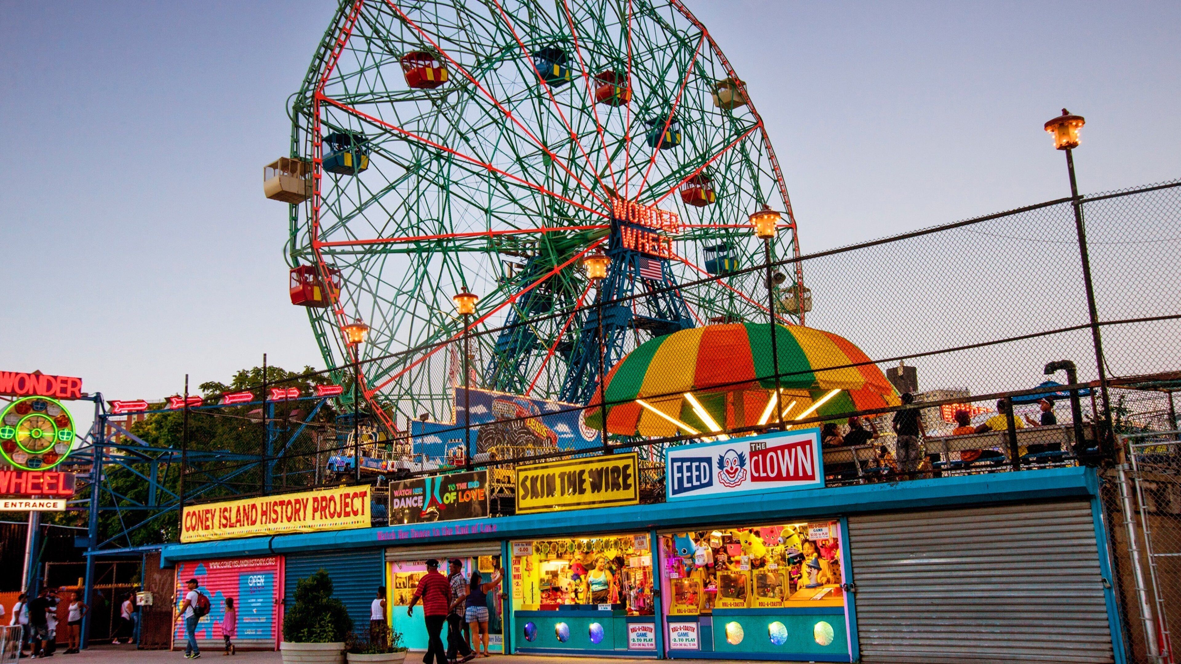 Coney Island featuring a sunset and rides