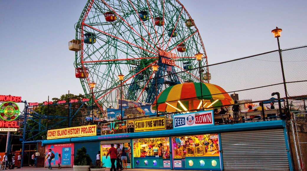 Coney Island featuring a sunset and rides