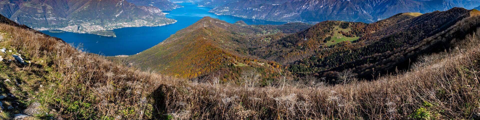 A mountainous landscape with a lake and a town.