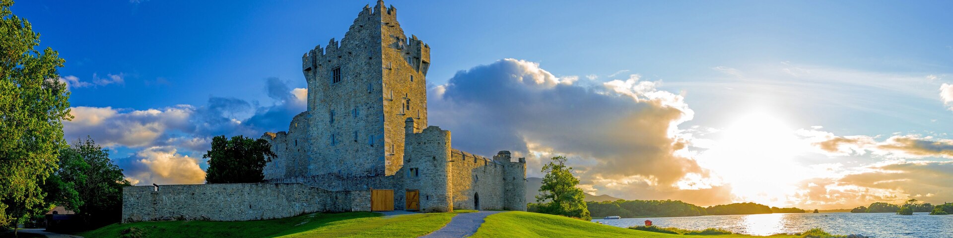 Idyllic landscape of Ross Castle in the Killarney National Park in Ireland. Travel by car through the Ring of Kerry.